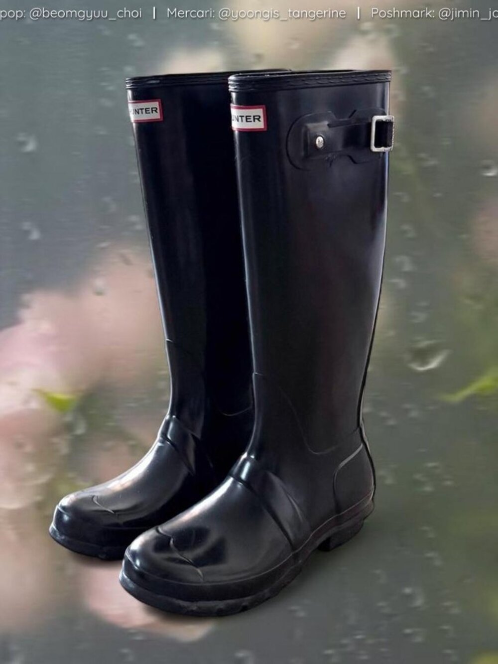 Tall glossy black Hunter rain boots